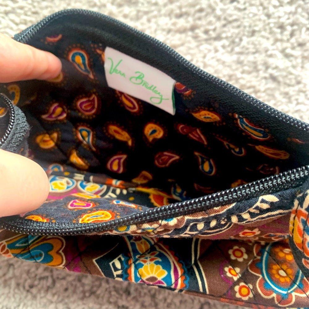 Vera Bradley purse. Dimensions are 9 inches in length and 4 inches in height